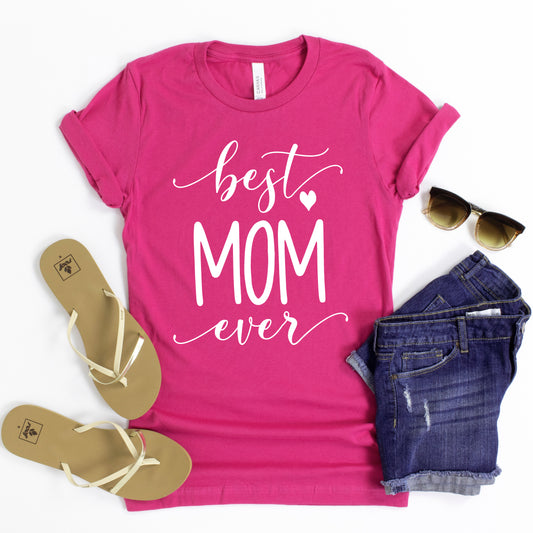 a t - shirt that says best mom ever next to a pair of jeans and